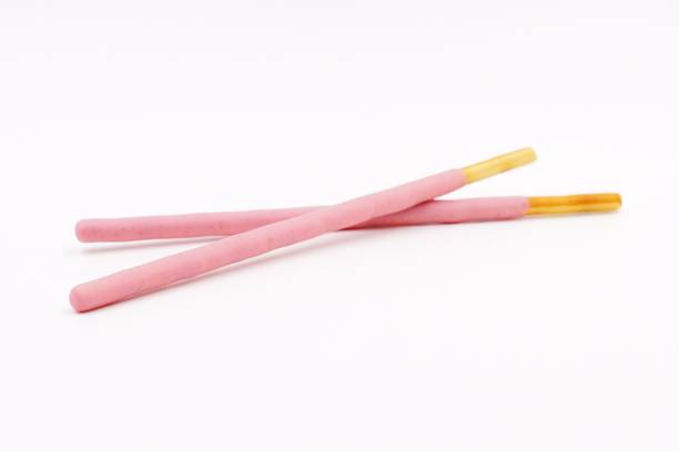 istock Biscuit sticks coated with strawberry flavour confectionery 1068874890