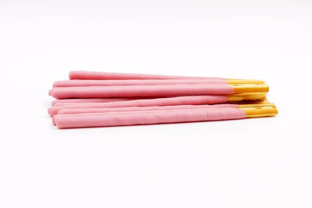 istock Biscuit sticks coated with strawberry flavour confectionery 1068874898