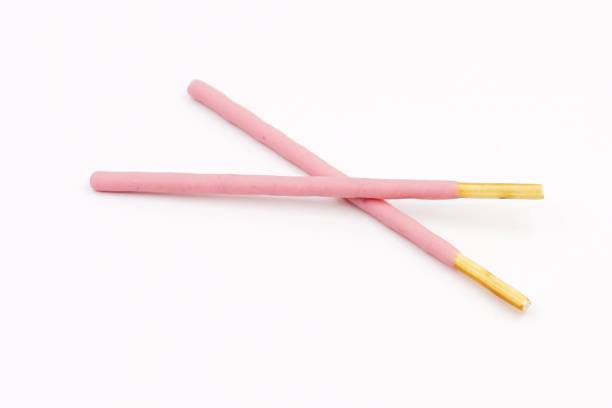 istock Biscuit sticks coated with strawberry flavour confectionery 1068874946