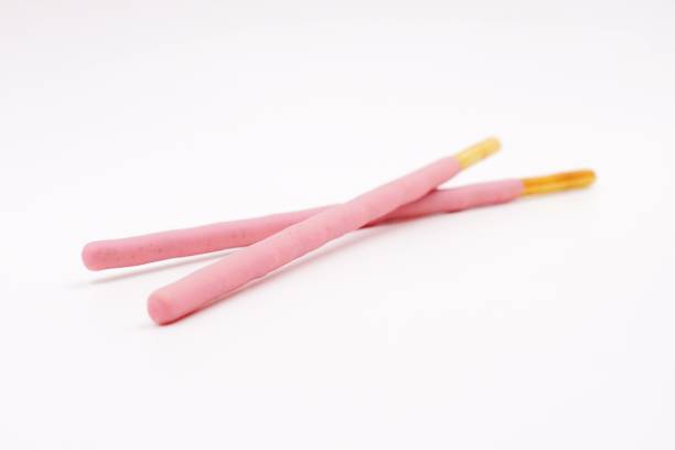istock Biscuit sticks coated with strawberry flavour confectionery 1068876552