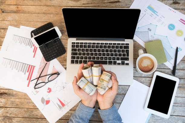 Financial business reports and us paper banknotes