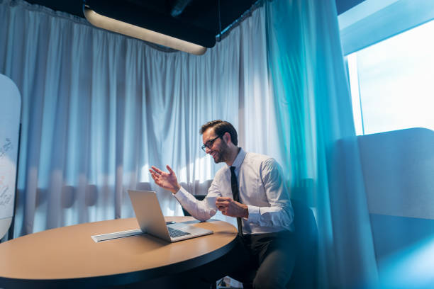 Businessman having video call in conference room..