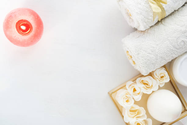 istock Spa still life, Spa soaps, white towels and sponges on wood background. Selective focus. 1068885968