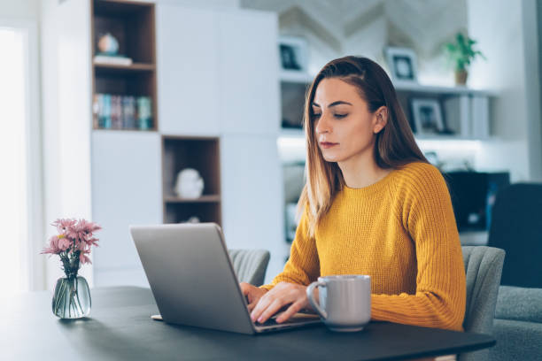 istock Young woman home office 1068899448