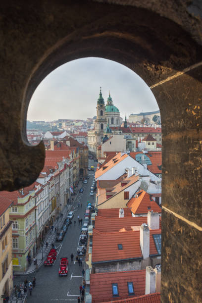 View of St. Nicholas church from a tower of Charles bridge, Prague View of Mostecka street and St. Nicholas church from a tower of Charles bridge, Mala Strana, Prague, Czech Republic st nicholas church prague stock pictures, royalty-free photos & images