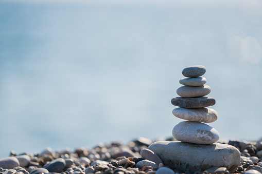 A stack of rocks atop a rocky climb