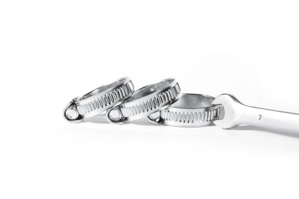 istock New metal hose clamps with threaded connection for pipes, stainless steel, small size on isolated white background close-up 1068911908