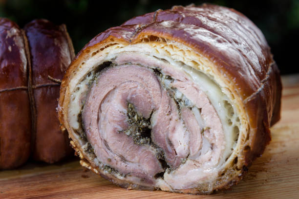 istock Roasted rolled pork cut in half on chopping board 1068915576