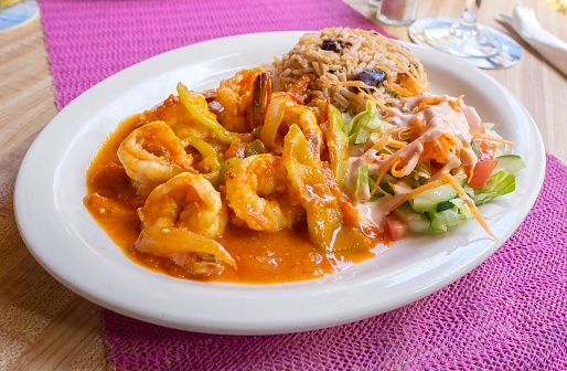 Creole Shrimp Served with Salad and Rice and Beans