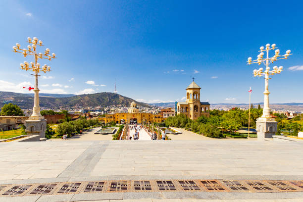 istock Beautiful view to chapel on site to Sameba Cathedral Tsminda in Tbilisi Holy Trinity . Biggest church Orthodox in Caucasus Georgia region in a sanny day. The main cathedral of the Georgian Orthodoxy 1068916614