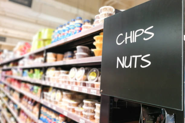 istock Chips and Nuts grocery category aisle at supermarket 1068925254
