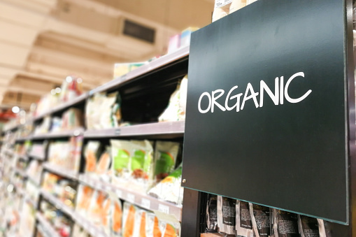 Organic products grocery category aisle at supermarket