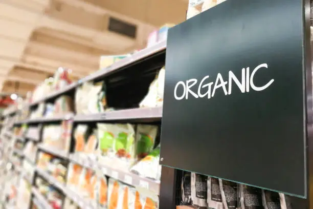 Organic products signage grocery category aisle at supermarket