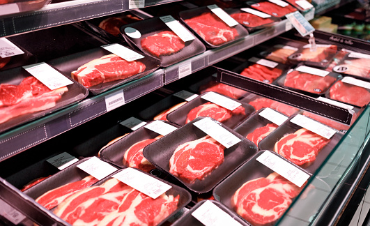 Showcase beef steaks meat products in a supermarket