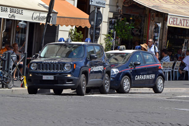 Jeep Renegade and Fiat Punto in gendarmerie version Rome, Italy - 1st June, 2018: Jeep Renegade and Fiat Punto in gendarmerie (Carabinieri force) version parked on the street. Carabinieri force are the national gendarmerie of Italy, policing both military and civilian populations. punto stock pictures, royalty-free photos & images