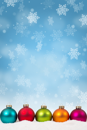 Many colorful Christmas balls baubles background decoration portrait format snowflakes snow winter copyspace