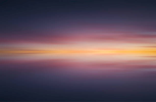 istock Reflection of colorful abstract sunset background - Stock image 1068954988