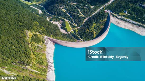 Aerial View At The Dam Energy Power Station In The Mountains Landscape From The Drone Technology Composition From Air Stock Photo - Download Image Now