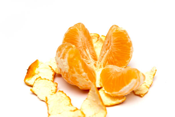istock Fresh peeled mandarin orange isolated on white background 1068963198