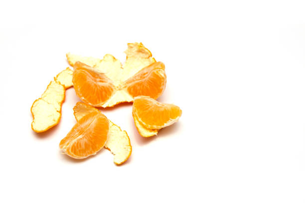 istock Fresh peeled mandarin orange isolated on white background 1068963226