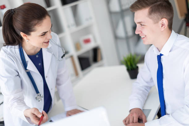 istock The doctor explains the problem to the patient on the computer. 1068972362