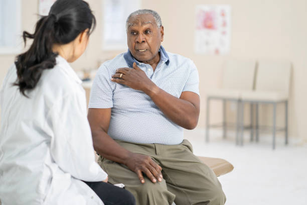 istock Senior man explaining to doctor 1068972558