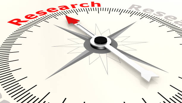 istock Compass with arrow pointing to the word research 1068978868
