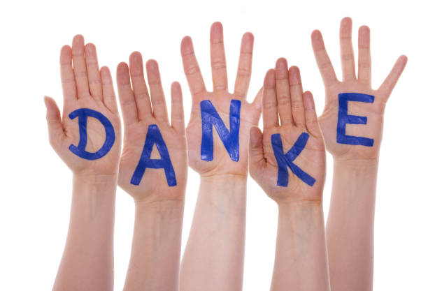 istock Many Hands Building Danke Means Thank You, Isolated 1068980636