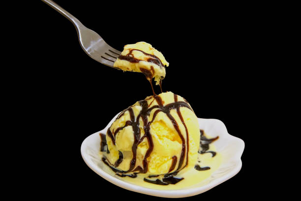 vanilla ice cream scoop with fork, Isolated on black background