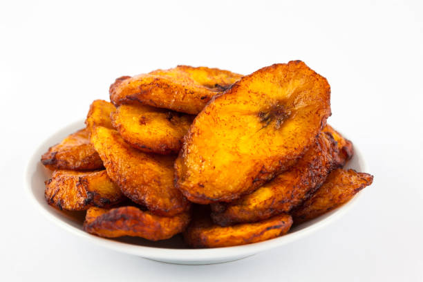 istock Deep fried ripe plantain slices isolated in white background 1068984390