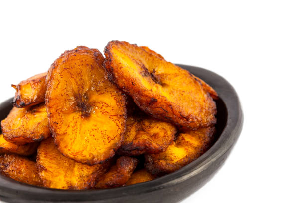 istock Deep fried ripe plantain slices isolated in white background 1068984856