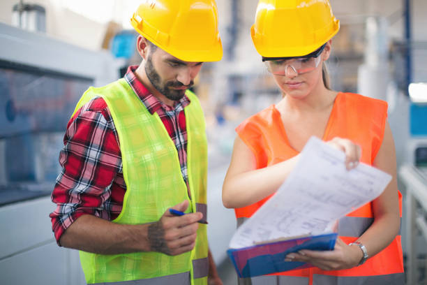 istock Workers in pvc factory at work 1068987866
