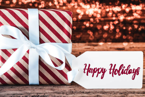 istock One Christmas Gift, Calligraphy Happy Holidays, Bokeh 1068988348