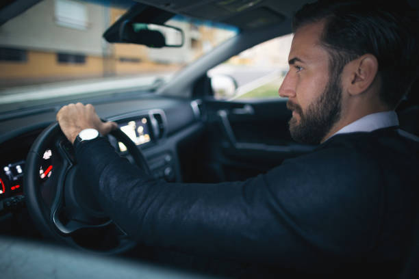 istock Businessman driving a car 1068995500