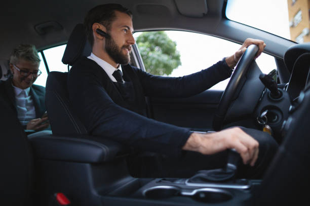 istock Businessman driving a car 1068995544