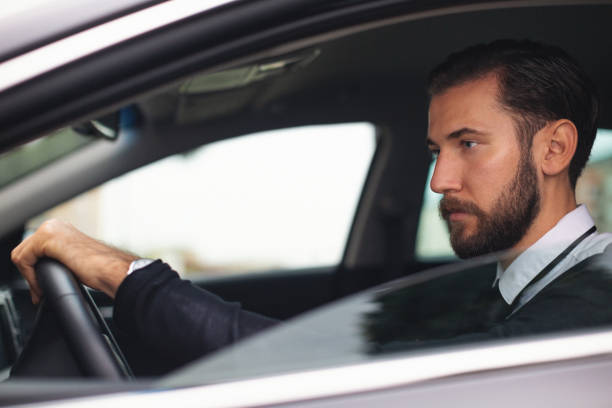 istock Businessman driving a car 1068995582
