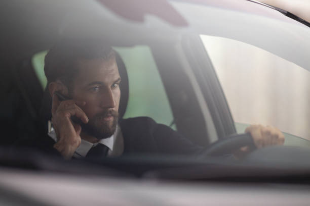 istock Businessman driving a car 1068995622