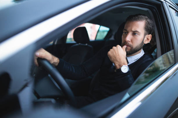 istock Businessman driving a car 1068995822
