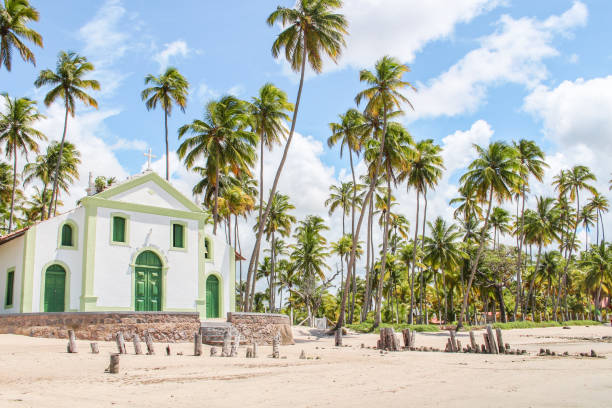 Church on the beach with coconut trees around stock photo