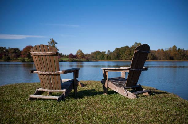 istock Adirondack Chairs Next to a Lake in Autumn 1069001742