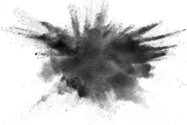istock Black powder explosion. The particles of charcoal splatter on white background. Closeup of black dust particles splash isolated on  background. 1069006812