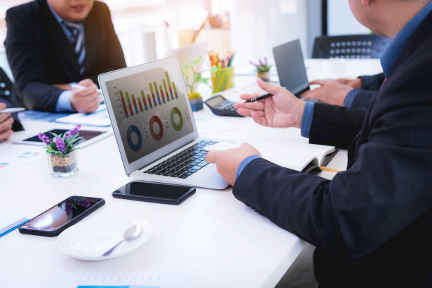 istock Business people explain analyze of sales plan with using laptop show marketing share document in the future. 1069009174