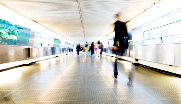 istock Group of people walking on city footbridge 1069019230
