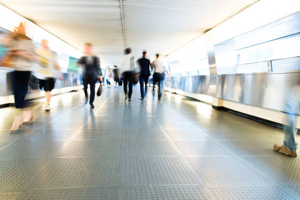 istock Group of people walking on city footbridge 1069019254
