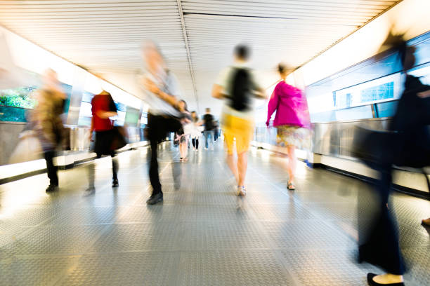 istock Group of people walking on city footbridge 1069019260