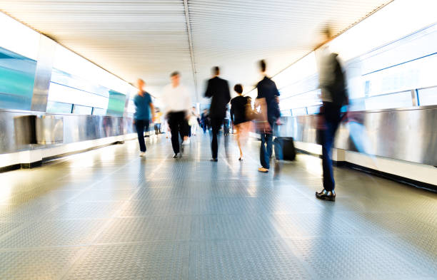 istock Group of people walking on city footbridge 1069019284