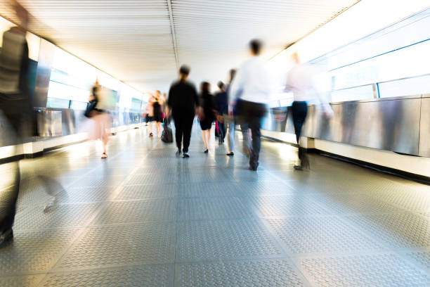 istock Group of people walking on city footbridge 1069019288