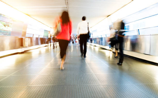 istock Group of people walking on city footbridge 1069019322