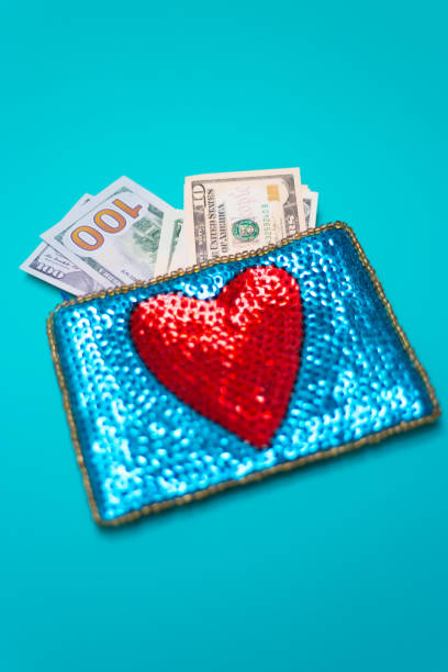 istock Dollar Bills in Glittery Change Purse with Heart 1069020002