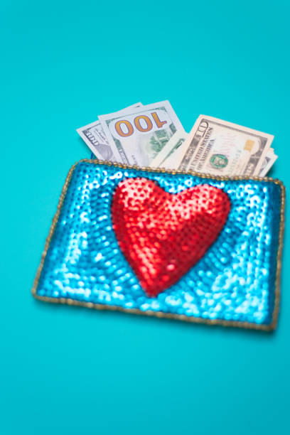 istock Dollar Bills in Glittery Change Purse with Heart 1069021030